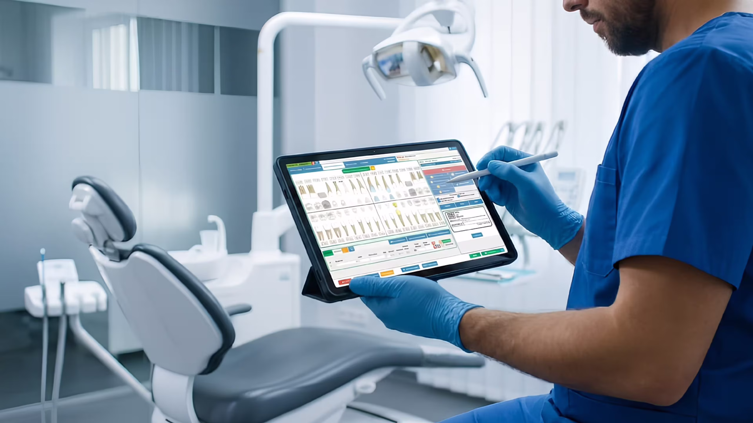 Dentist using modern dental management software on tablet in high-tech clinic